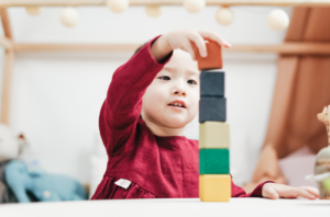 child building with blocks 