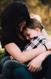 mother holding child 