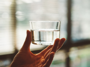 hand holding glass of water 